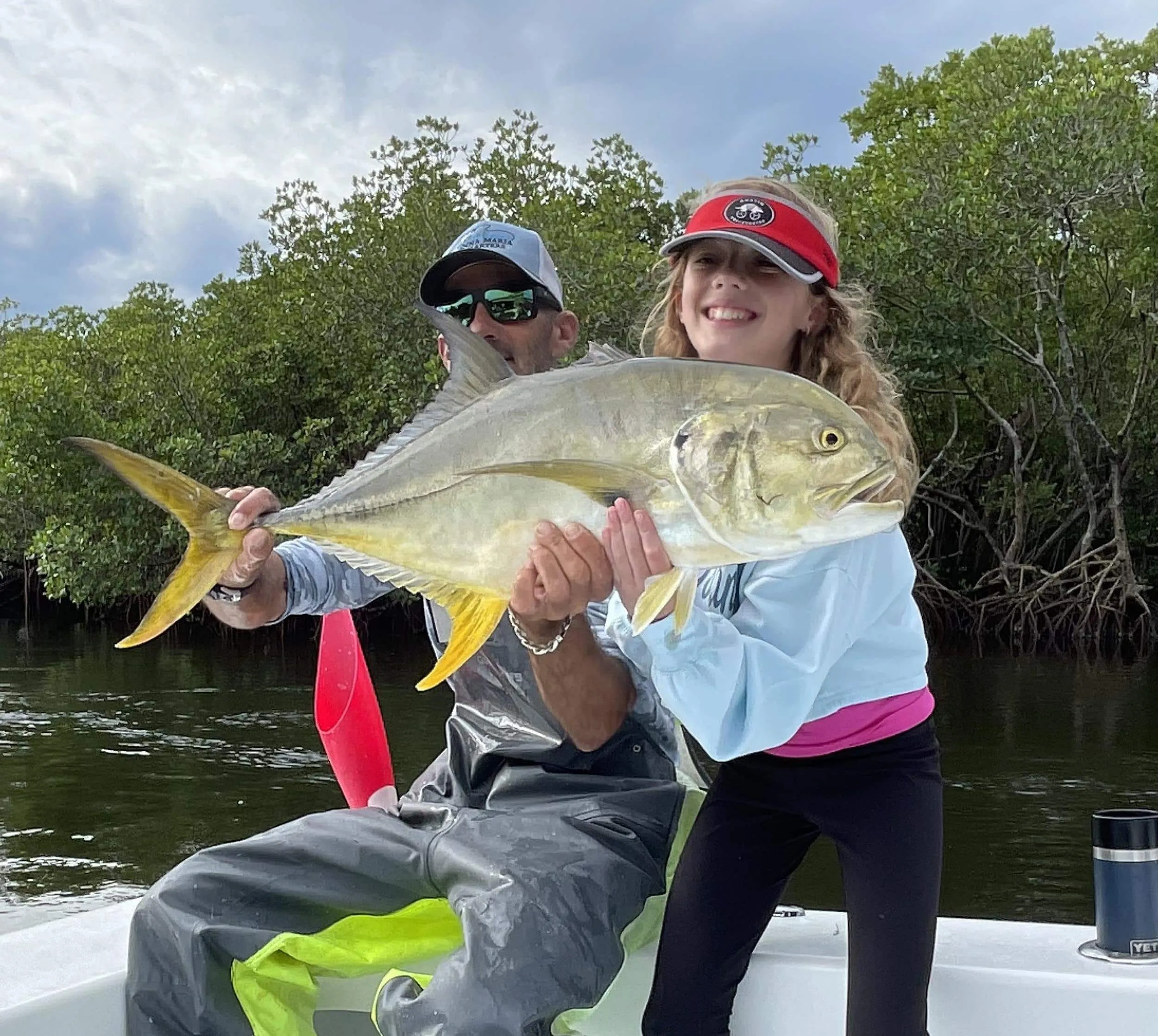Captain David White Fishing Charters client with their catch