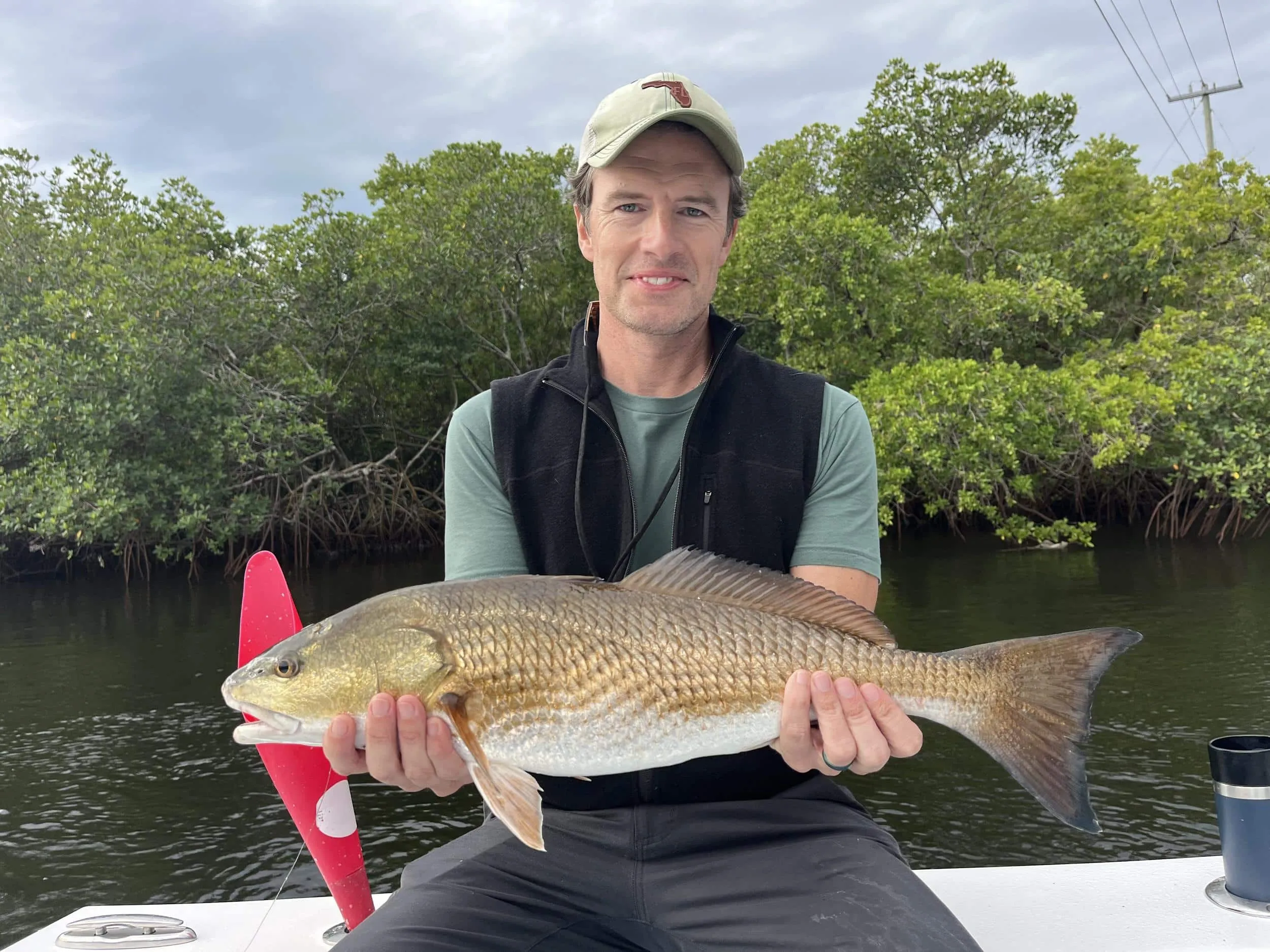 Captain David White Fishing Charters client with their catch