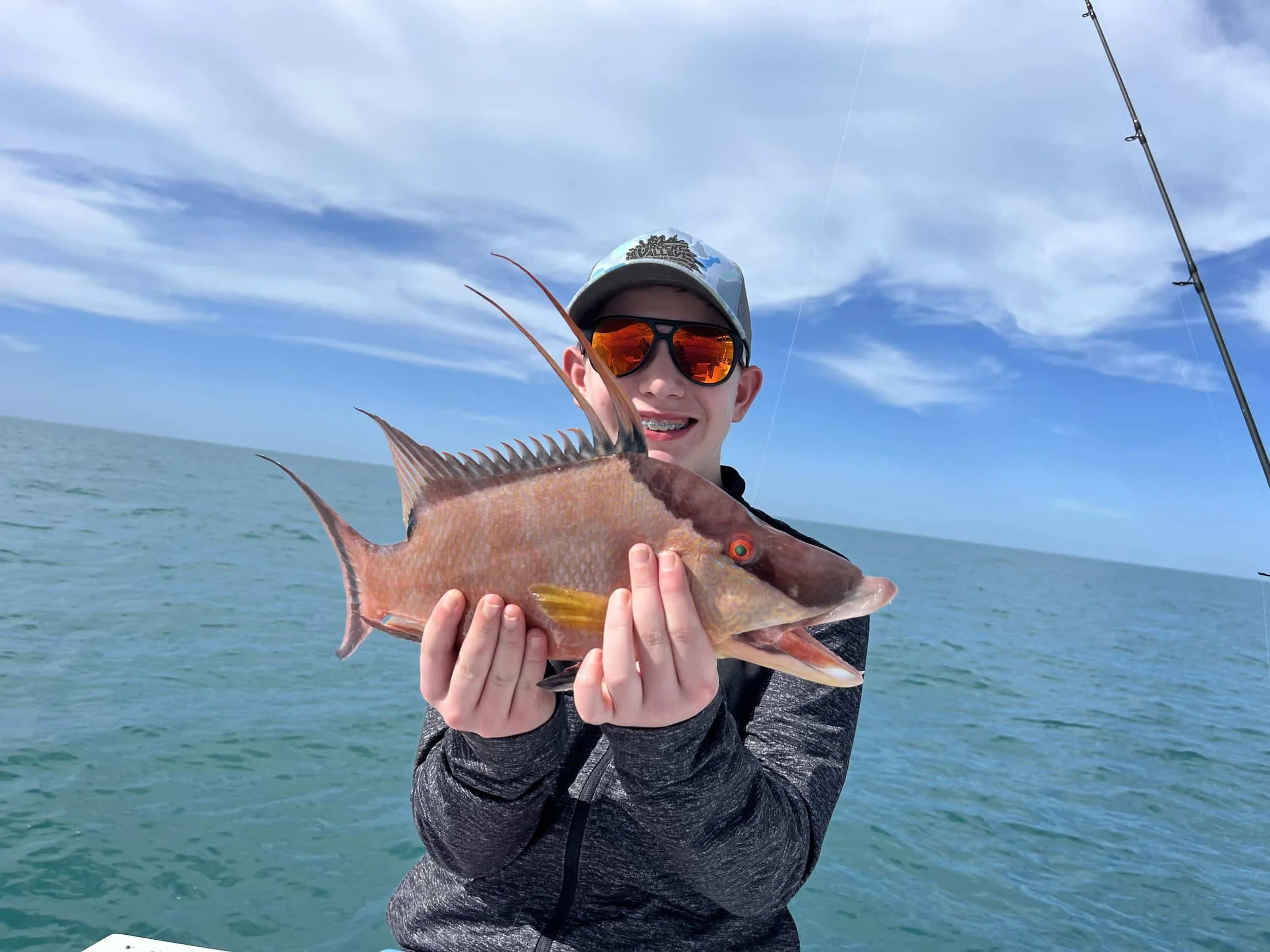 Captain David White Fishing Charters client with their catch