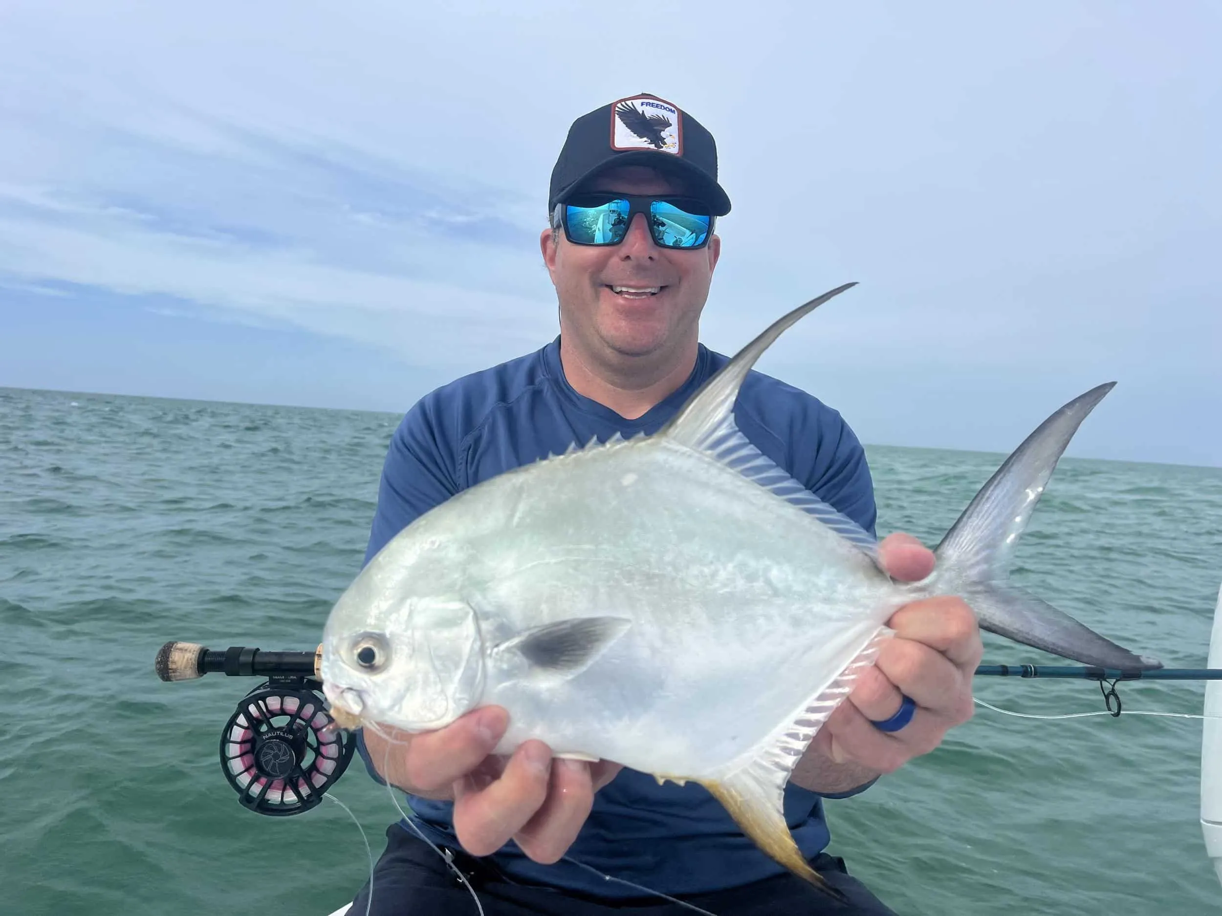 Captain David White Fishing Charters client with their catch