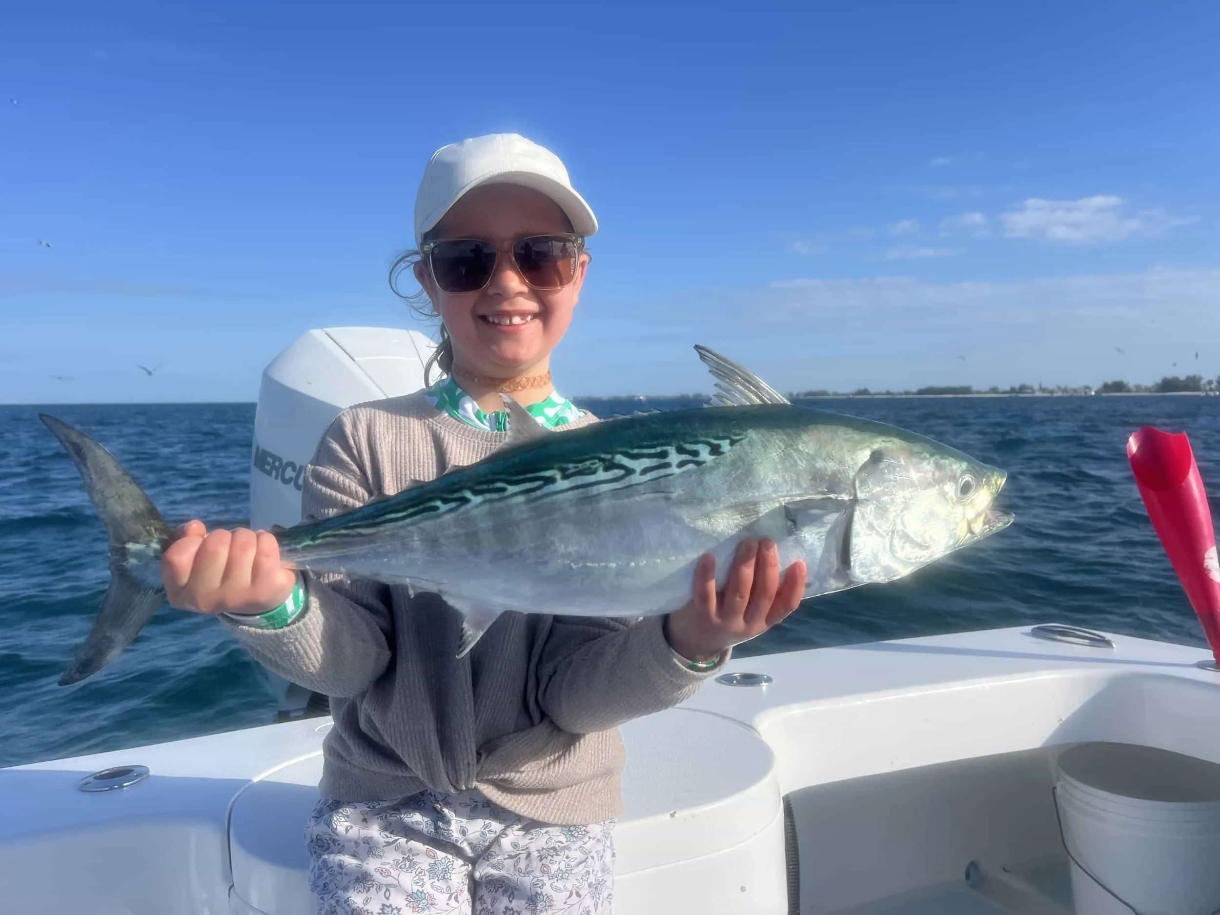 Captain David White Fishing Charters client with their catch